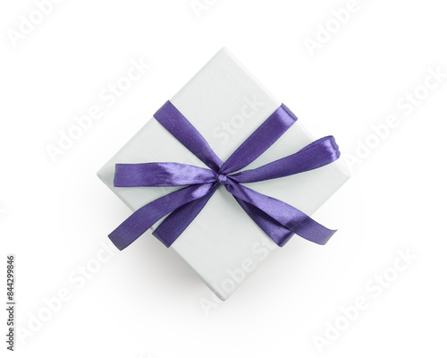 Top view of white gift box with violet ribbon isolated on white background