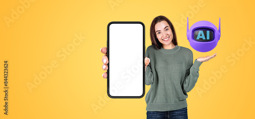 Woman with mock up phone display, smiling Ai bot on her hand