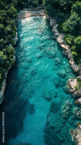 A beautiful blue river with a rocky shoreline