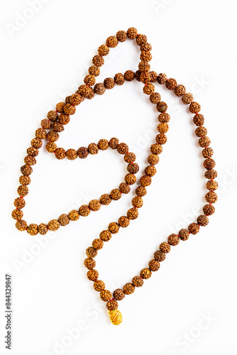 Handmade rudraksha seed necklace, isolated on white background. Used in Hinduism and Buddhism.