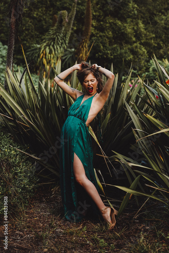 Indigenous woman posing in a garden of cactus and flowers 