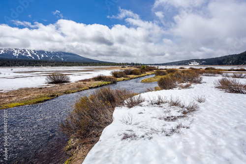 Beautiful landscape in early spring with melting snow on a meadow in Mt. Bachelor area in Oregon