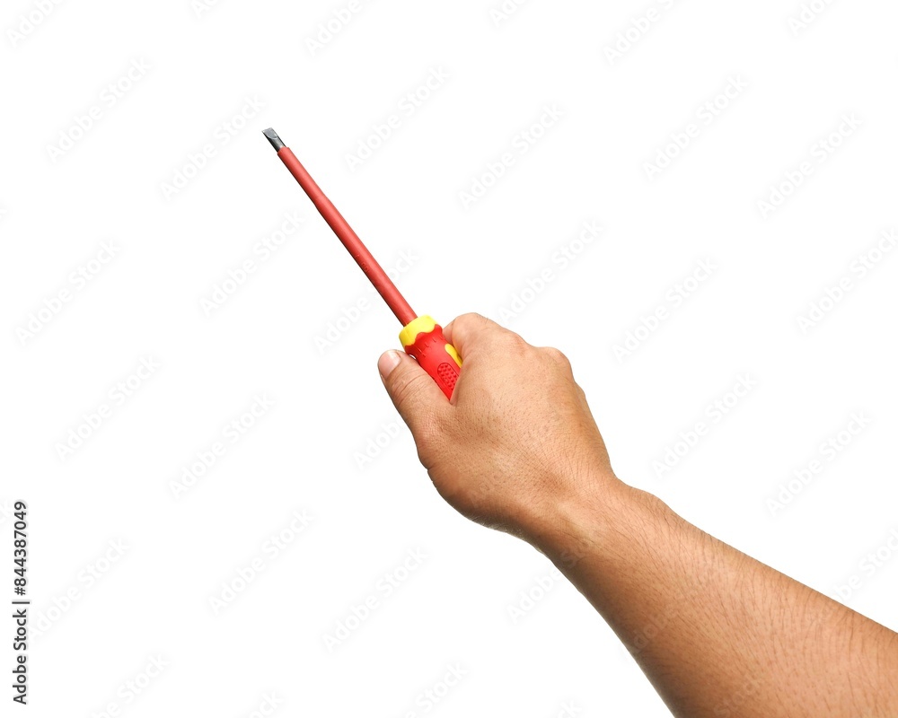 A man's hand holds a yellow and red tool called a screwdriver for use in general mechanical, electrical, and general mechanics work. Equipment for tightening nut heads isolated on white background. A man's hand holds a yellow and red tool called a screwdriver for use in general mechanical, electrical, and general mechanics work. Equipment for tightening nut heads isolated on white background.