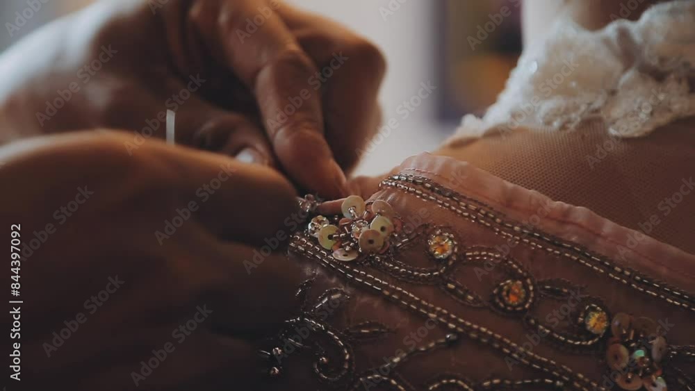 A skilled dressmaker fitting a dress on a mannequin, exhibiting utmost care and detail. A skilled dressmaker fitting a dress on a mannequin, exhibiting utmost care and detail.