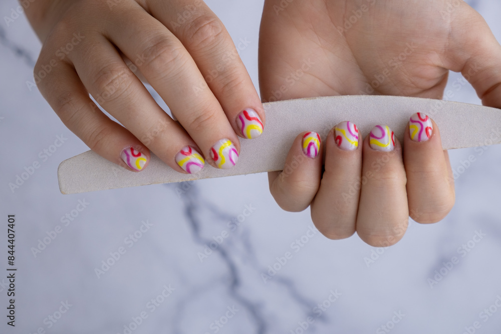 Stylish colorful summer female nails. Modern trendy stylish Beautiful manicure. Cute pastel nail minimalistic design concept of beauty treatment. Gel nails. Skin care. Beautician Manicure tools Stylish colorful summer female nails. Modern trendy stylish Beautiful manicure. Cute pastel nail minimalistic design concept of beauty treatment. Gel nails. Skin care. Beautician Manicure tools