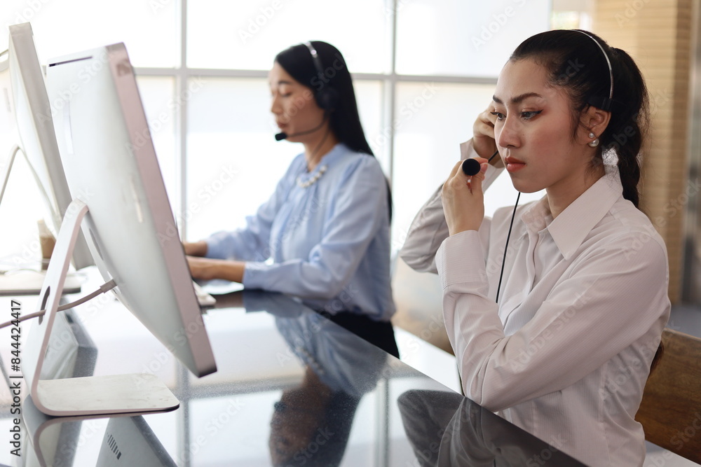Reception center woman setup for contact customer at desk in the office. Reception center woman setup for contact customer at desk in the office.