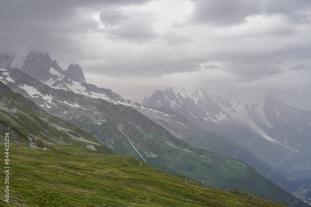 Obraz premium Beautiful views over the mountains with snow on the top of the mountains. The nature while hiking the Tour du Mont Blanc. 
