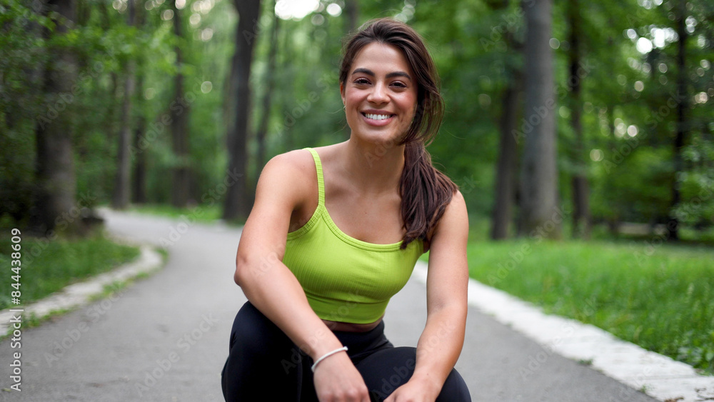 Beautiful, young woman taking a break while running and enjoying in the nature Beautiful, young woman taking a break while running and enjoying in the nature