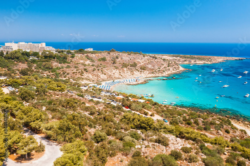 Fototapeta Naklejka Na Ścianę i Meble -  Aerial view of picturesque coastal Coral Bay beach resort. Peyia, Paphos Dsitict, Cyprus