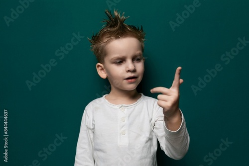 Foto Little Boy With Mohawk Pointing at Camera