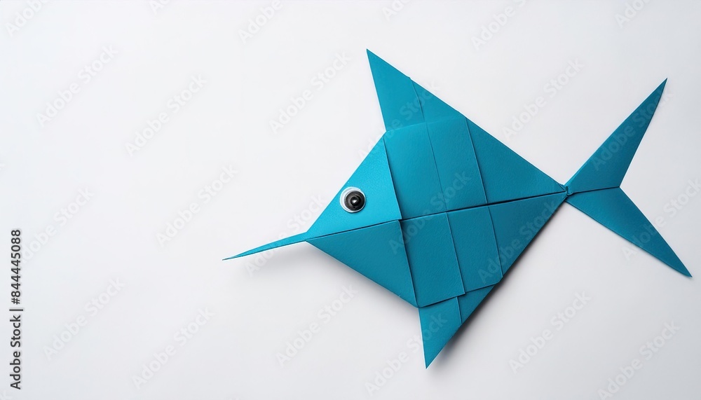 Animal aquatic water concept origami isolated on white background of a cute, adorable, sailfish - the fastest fish in the ocean. with copy space, simple starter craft for kids Animal aquatic water concept origami isolated on white background of a cute, adorable, sailfish - the fastest fish in the ocean. with copy space, simple starter craft for kids