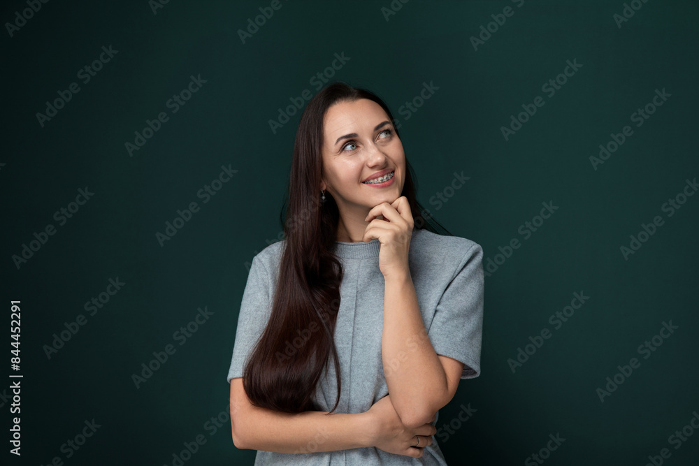 Woman Standing in Front of Green Wall Woman Standing in Front of Green Wall