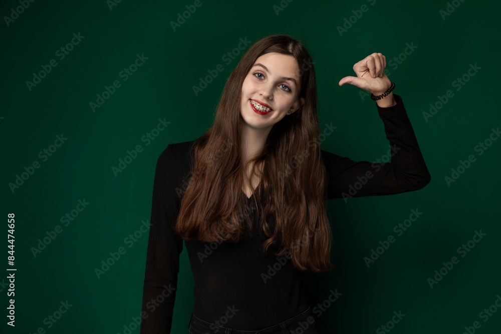 Woman Posing in Front of Green Background Woman Posing in Front of Green Background