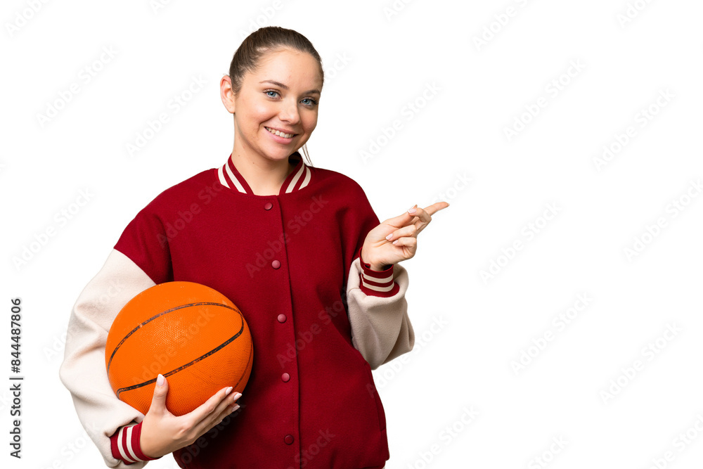Young blonde woman playing basketball over isolated chroma key background pointing finger to the side Young blonde woman playing basketball over isolated chroma key background pointing finger to the side