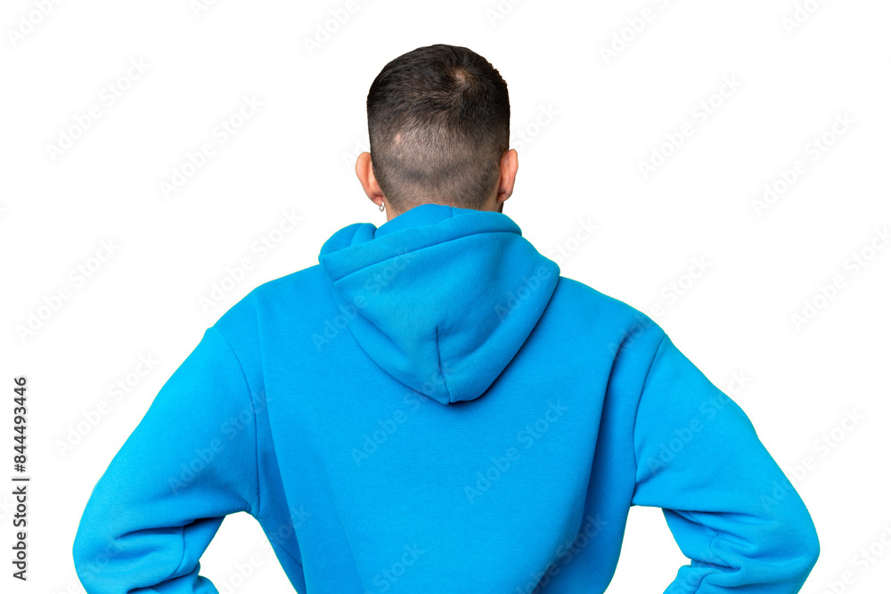 Young handsome caucasian man over isolated chroma key background in back position Young handsome caucasian man over isolated chroma key background in back position