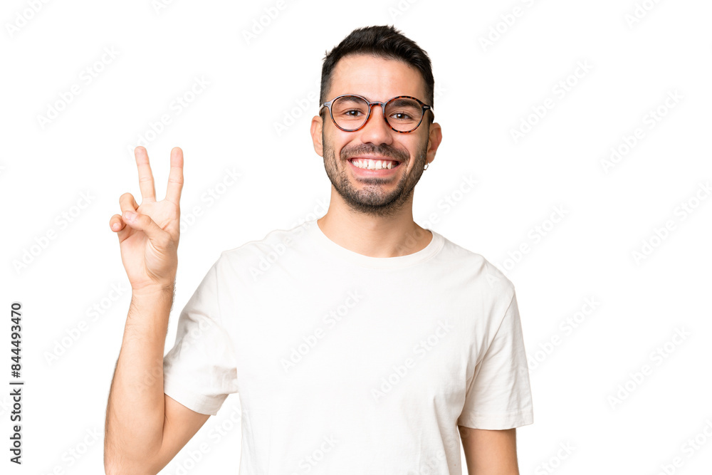Young handsome caucasian man over isolated chroma key background smiling and showing victory sign Young handsome caucasian man over isolated chroma key background smiling and showing victory sign