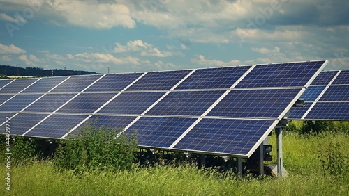 Solar power plant - concept for electricity and ecological industry. High energy prices. Beautiful landscape and sunny day with blue sky. Photovoltaic power plant.