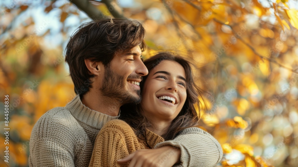 Embracing Autumn's Joy: Smiling Couple in Cozy Knit Sweaters Amidst Golden Leaves, Celebrating Love, Warmth, and Togetherness in Nature's Serene and Beautiful Setting Embracing Autumn's Joy: Smiling Couple in Cozy Knit Sweaters Amidst Golden Leaves, Celebrating Love, Warmth, and Togetherness in Nature's Serene and Beautiful Setting