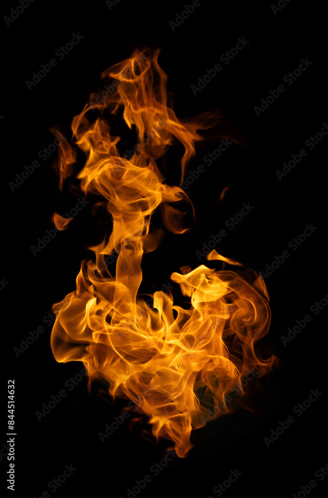 Fire and burning flame of explosive fireball isolated on dark background for abstract graphic design concept Fire and burning flame of explosive fireball isolated on dark background for abstract graphic design concept