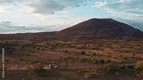 Kenya Safari Vehicle traveling at sunset