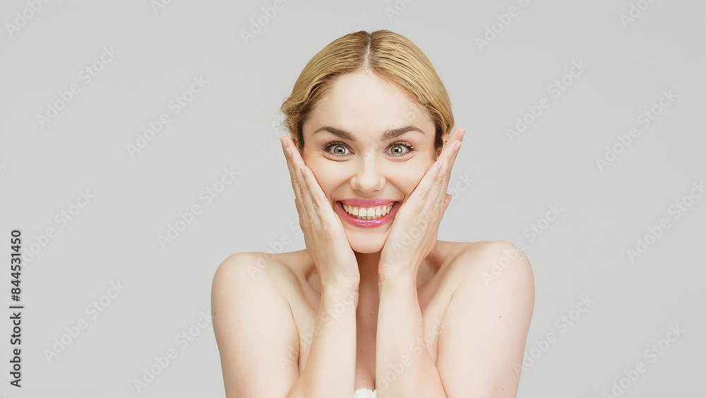 Portrait of a beautiful young blonde woman with perfect facial skin on a white background. The concept of advertising healthy skin, beauty and cosmetology. Portrait of a beautiful young blonde woman with perfect facial skin on a white background. The concept of advertising healthy skin, beauty and cosmetology.
