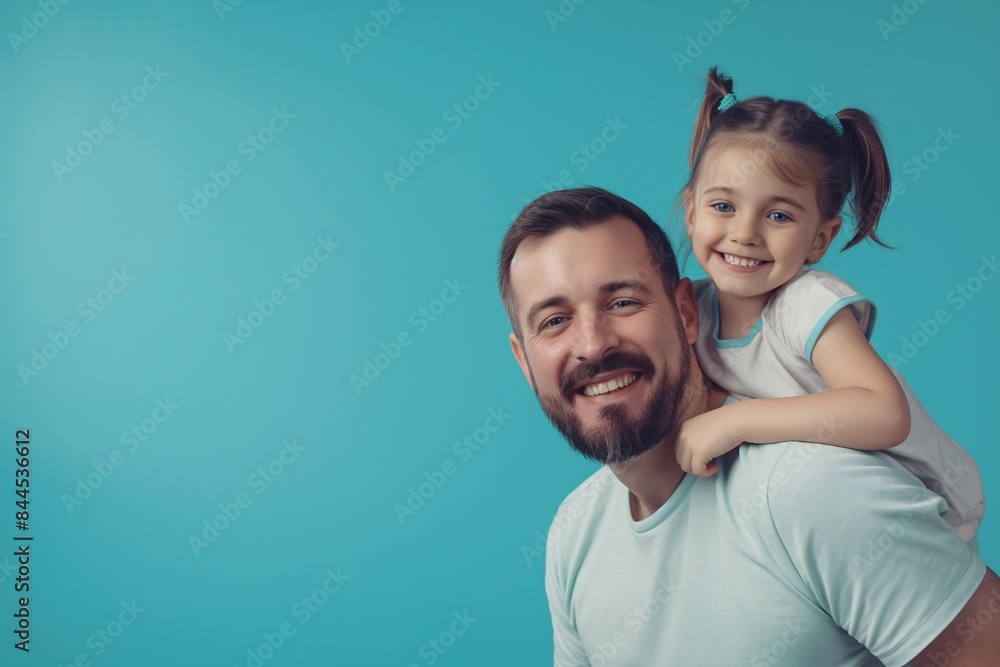 A joyful portrait of a father and daughter smiling warmly against a blue background. The image captures the love and happiness shared between them, perfect for Father's Day themes and family bonding A joyful portrait of a father and daughter smiling warmly against a blue background. The image captures the love and happiness shared between them, perfect for Father's Day themes and family bonding