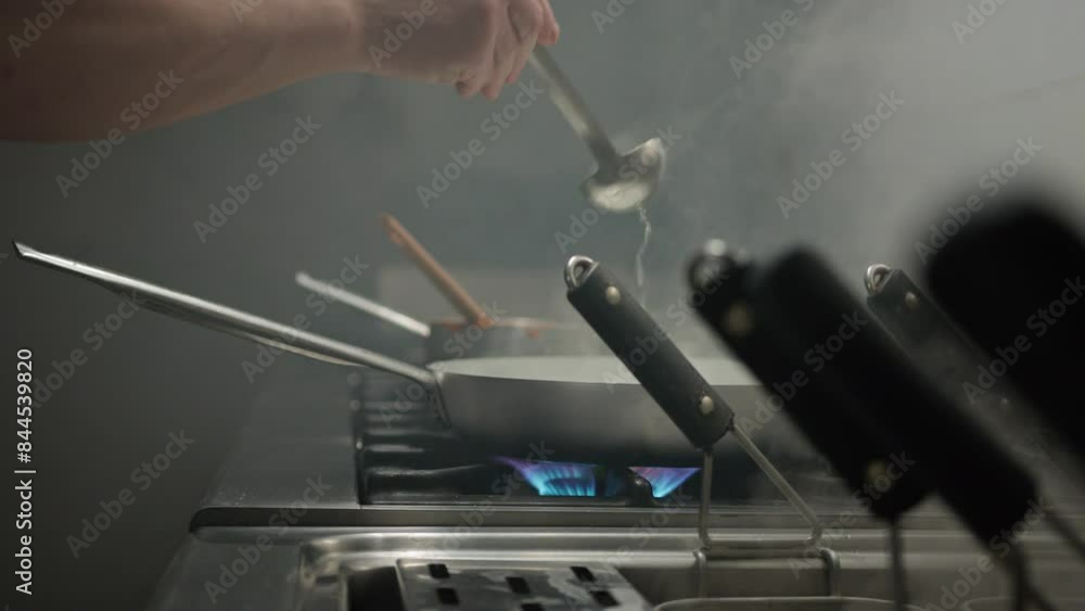 Adding Water To The Pan To Complete The Cooking Adding Water To The Pan To Complete The Cooking