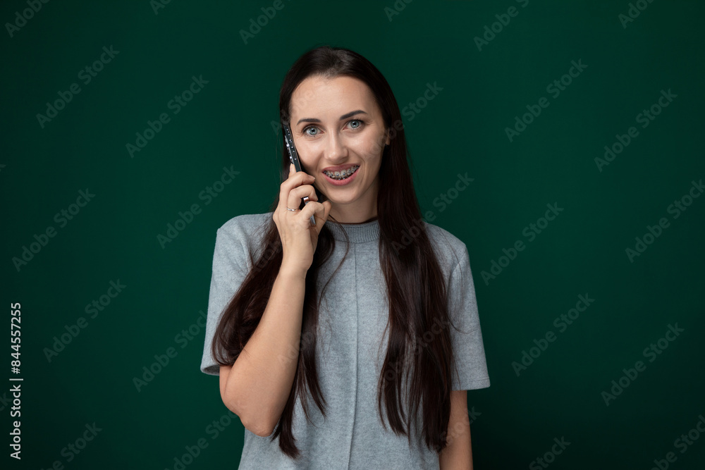 Woman Smiling While Talking on Cell Phone Woman Smiling While Talking on Cell Phone