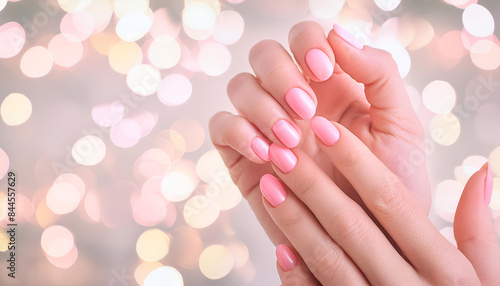 Beautifull pink nails, Light pink nail arts on young women's hand