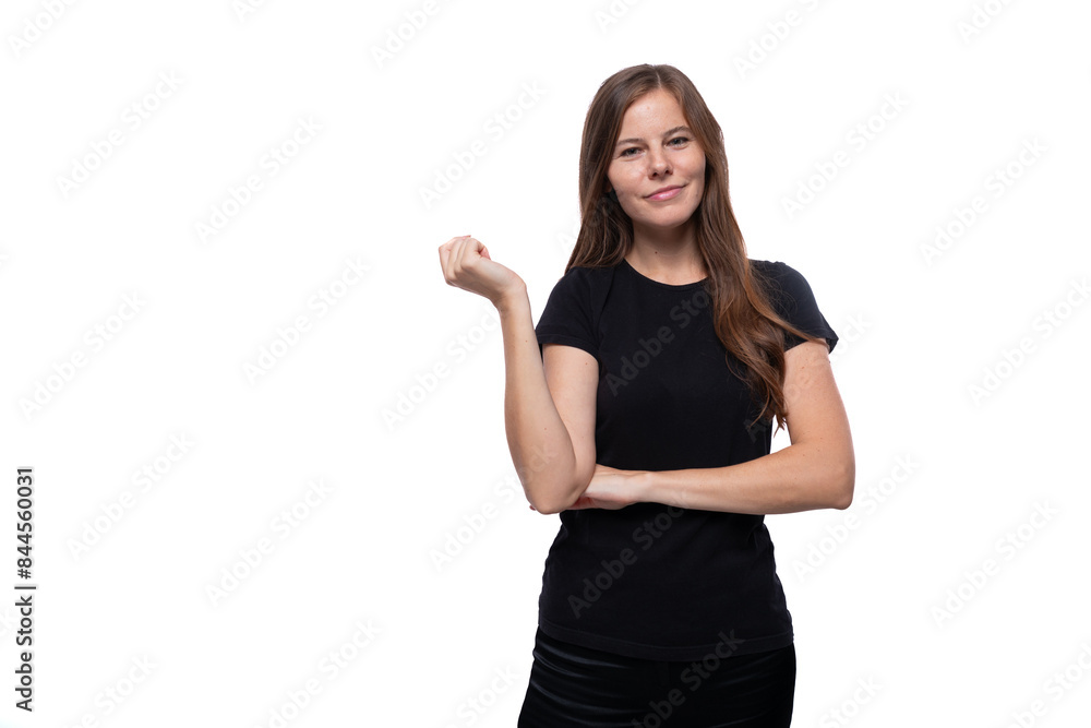 Dreamy young woman with straight hair wearing a black T-shirt on a white background Dreamy young woman with straight hair wearing a black T-shirt on a white background