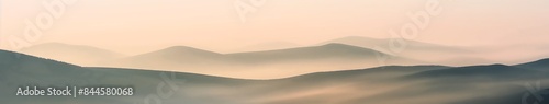 view of the mountains, Sunrise Over Hills Captivating blurred background image of rolling hills bathed in the soft light of sunrise, with morning mist and a pastel-colored sky.