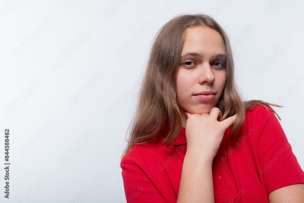 Caucasian girl with brown hair is wearing a red T-shirt Caucasian girl with brown hair is wearing a red T-shirt