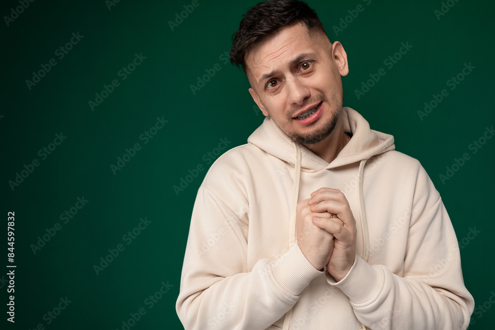 Man in White Hoodie Posing for Picture Man in White Hoodie Posing for Picture