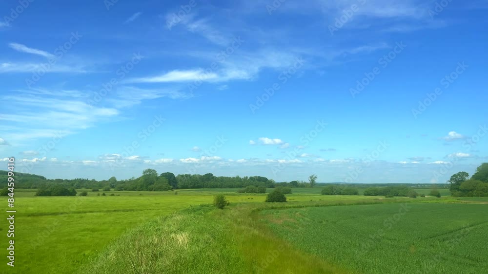 English countryside landscape in summer, green fields and blue sky, nature, rural farm life and agriculture concept English countryside landscape in summer, green fields and blue sky, nature, rural farm life and agriculture concept