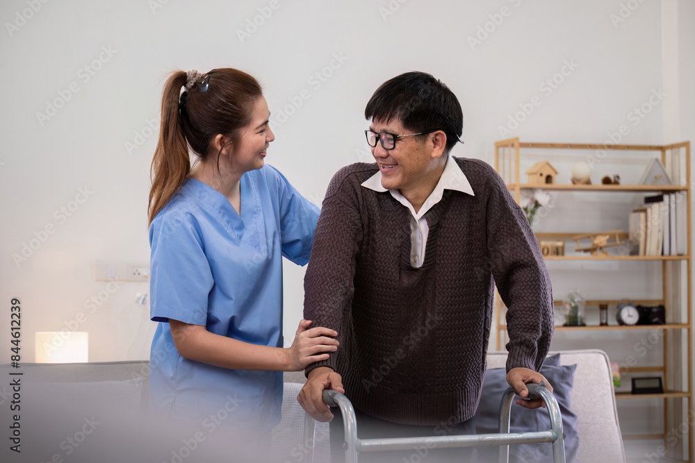 Obraz premium Caregiver Assisting Elderly Man with Physical Therapy Using a Walker in a Comfortable Home Setting