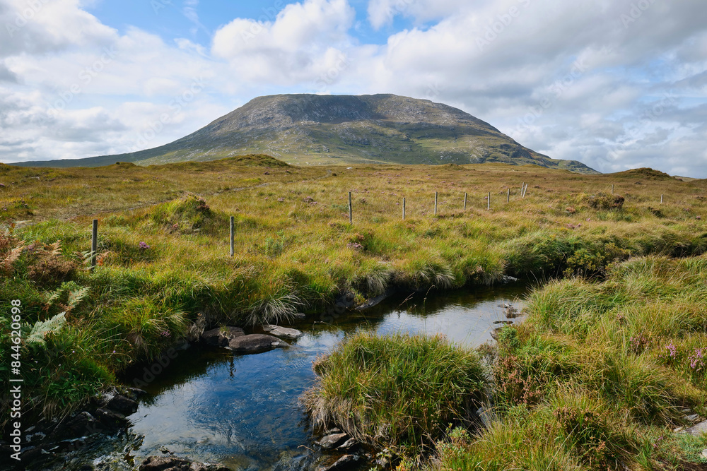 Landscape scenery, river stream with mountains in background, Connemara, Galway, Ireland hiking area, green meadow Landscape scenery, river stream with mountains in background, Connemara, Galway, Ireland hiking area, green meadow