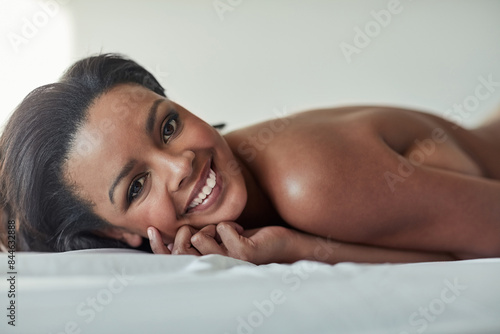Фотография Woman, happy and portrait for seduction, naked and natural makeup glow for beauty or smile in bedroom