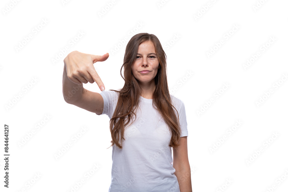European young woman with straight brown hair wearing a white T-shirt European young woman with straight brown hair wearing a white T-shirt