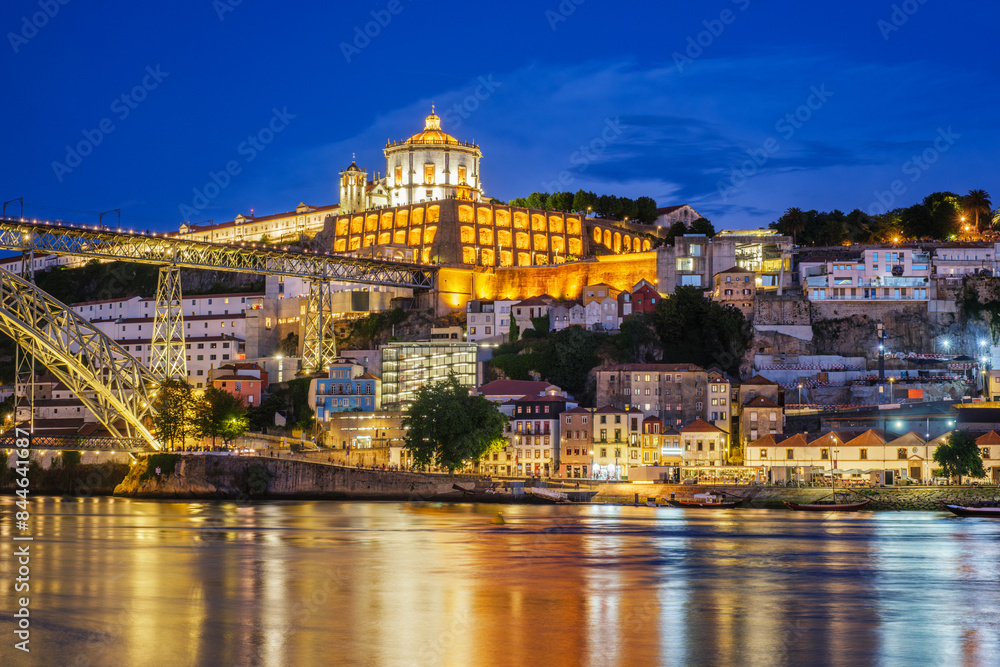 View of Vila Nova de Gaia city with Mosteiro da Serra do Pilar monastery and Dom Luis I bridge over Douro river in evening twilight. Porto, Vila Nova de Gaia, Portugal View of Vila Nova de Gaia city with Mosteiro da Serra do Pilar monastery and Dom Luis I bridge over Douro river in evening twilight. Porto, Vila Nova de Gaia, Portugal