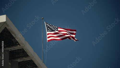 Wallpaper Mural United States flag waving against a clean blue sky in slow motion Torontodigital.ca