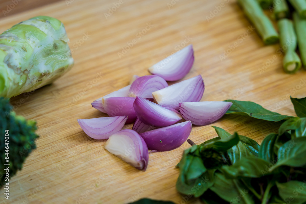 Cutting board with ingredients for preparing green curry with herbs and rice Cutting board with ingredients for preparing green curry with herbs and rice