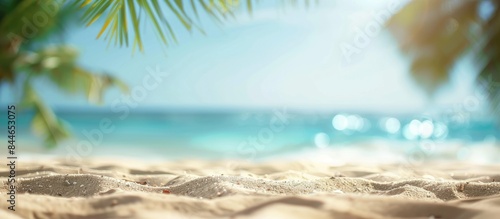 Blurred tropical sandy beach background with sand  conveying the essence of a summer vacation and product promotion concept.