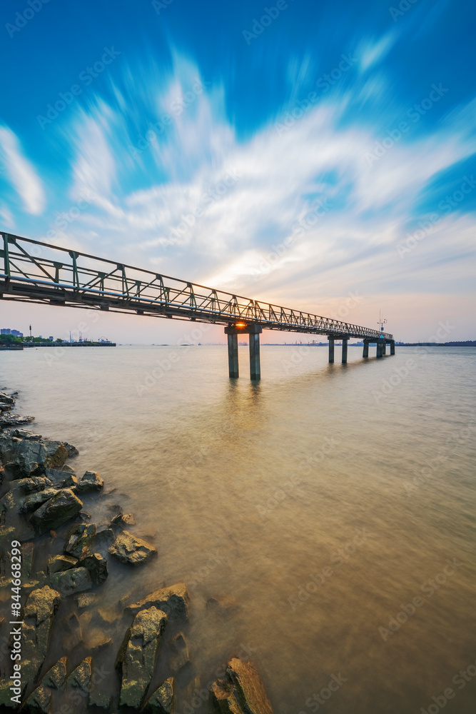 Fototapeta premium The Pier and Sunset Scenery of the Yangtze River Port in Jiangsu Province, China