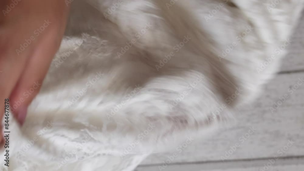 Woman unboxes and reviews chic white pants in vertical video format. Stylish summer attire. Woman unboxes and reviews chic white pants in vertical video format. Stylish summer attire.