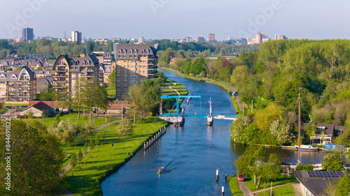 Aerial drone photo of the river Vliet with a bridge in Voorschoten, the Netherlands