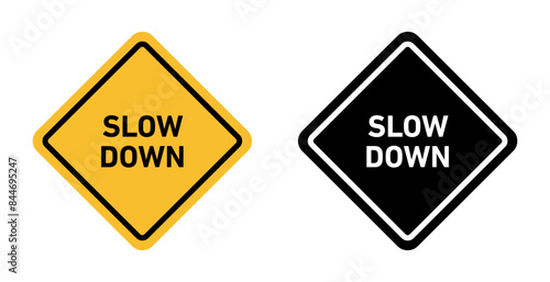 Slow down sign indicating the need to reduce speed for safety