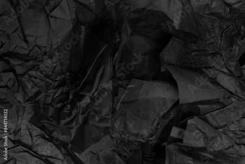 Abstract black paper texture background. Top view.