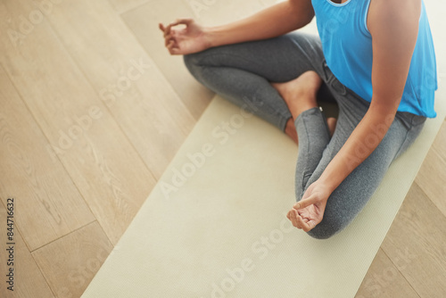 Hands, lotus meditation and woman in home for health, wellness and mindfulness exercise. Person, yoga chakra and calm yogi meditate for spiritual training, holistic workout or peace in living room © peopleimages.com