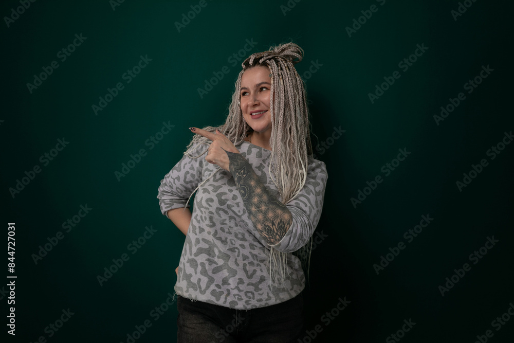 Woman With Dreadlocks Standing in Front of Green Wall Woman With Dreadlocks Standing in Front of Green Wall