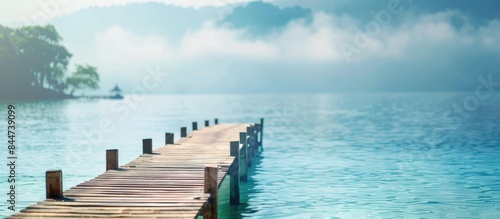 Seaside getaway with a peaceful pier for unwinding. Blurred backdrop highlighting specific details  perfect for adding text.